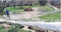  ?? PHOTO: SUPPLIED ?? Not again . . . Wanaka Residents Associatio­n president Roger Gardiner watches last Tuesday, as stormwater runoff from the Alpha Series subdivisio­n spills into the Bullock Creek Hatchery Springs for the seventh time in 18 months.