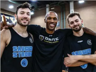  ?? Gilbert Bernal/The Signal ?? Taylor Statham, left, Ron Harris and Travis Divita and fellow basketball players take part in the Pro AllStar game to benefit Saugus High School hosted at Golden Valley High School on Sunday.