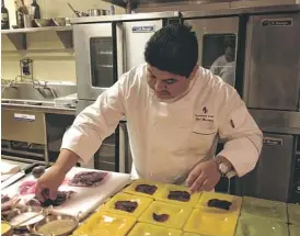  ??  ?? Executive chef Mel Mecinas shows guests how to prepare a meal for their loved ones Saturday at the Feast for the Senses cooking class at the Four Seasons Resort Scottsdale at Troon North.