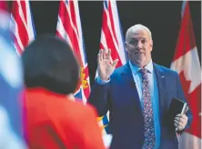  ?? Jonathan hayward/ the canadian Press ?? B.C. Lt.- Gov. Janet Austin swears in Premier John Horgan during a virtual ceremony on Thursday in Victoria.