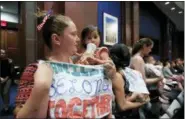  ?? MANUEL BALCE CENETA - THE ASSOCIATED PRESS ?? Lucy Martin and her daughter Branwen Espinal, together with other mothers and their babies, attend a House Committee on the Judiciary and House Committee on Oversight and Government Reform hearing, to express their support and sympathy to immigrants and their families and objection to the forced separation of migrant children from their parents, on Capitol Hill in Washington, Tuesday.