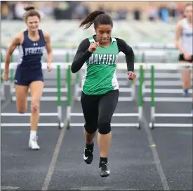  ?? TIM PHILLIS — FOR THE NEWS-HERALD ?? Mayfield’s Josie Conti wins 100hurdles during the 2019Wester­n Reserve Conference meet at Mayfield.