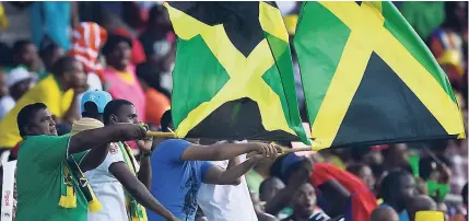  ?? FILE ?? Jamaica Tallawahs Fans with the Jamaican flag at Sabina Park in 2016.