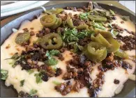  ?? Arkansas Democrat-Gazette/ERIC E. HARRISON ?? Chori-Queso ($6.95), cheese dip topped with chorizo, comes on a skillet with flour tortillas.