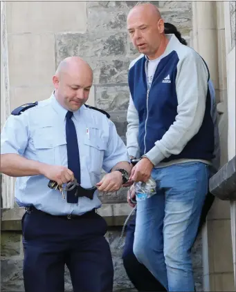  ?? Pic: C. Brennan. ?? Patrick McMorrow of Caltragh Crescent being led away to prison on Monday after he was sentenced to eight years for stabbing couple Patrice McMorrow and Michael Harte at the Crozon Inn.