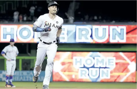  ?? THE ASSOCIATED PRESS FILES ?? Giancarlo Stanton hit 59 home runs and tallied 132 RBI for the Miami Marlins last season en route to being named National League MVP. Miami traded the slugger to the Yankees, further bolstering an already powerful lineup.