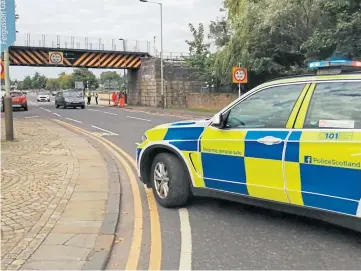  ??  ?? COLLISION: The roof of the lorry’s trailer struck the railway bridge in Tay Street, Perth.