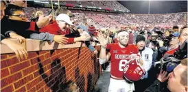  ?? [PHOTO BY BRYAN TERRY, THE OKLAHOMAN] ?? Baker Mayfield walks off Owen Field after the win over TCU earlier this month. Mayfield will not start Saturday’s regular-season finale and will not serve as a captain for the game.