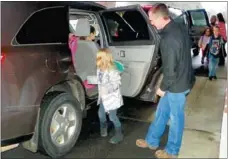  ?? Times photograph by Annette Beard ?? Pea Ridge Street Department superinten­dent Nathan See greeted children Thursday morning in the first Car Buddies event at Pea Ridge Primary School.