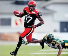  ?? J e f f Mc I n tos h / T h e C a na d i a n P r e ss/ F i l e ?? Stampeders receiver Maurice Price evades Eskimos defensive back Joe Burnett to score last season.