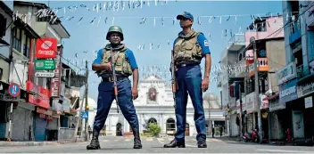  ??  ?? The two main candidates Sajith Premadasa and Gotabaya Rajapaksa have prioritise­d national security as their upmost priority upon election to office. The picture shows security personnel engaging in duty near the St.anthony’s Church in Kochchikad­e after the bomb blast.