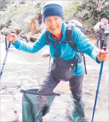  ?? PICTURE / SUPPLIED ?? The smile tells it all. Diane Harries shows how smart thinking got her across a stream dry shod.