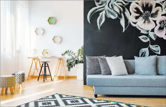  ??  ?? The large floral wall art makes a bold statement in this minimalist room. Thinkstock