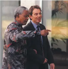  ?? Getty ?? Tony Blair and Nelson Mandela at the Commonweal­th Heads of Government Meeting in Scotland in October 1997