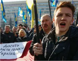  ?? (Valentyn Ogirenko/Reuters) ?? SUPPORTERS OF the nationalis­t Svoboda party rally in Kiev last month.