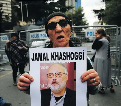  ?? LEFTERIS PITARAKIS/THE ASSOCIATED PRESS ?? An activist and member of the Human Rights Associatio­n’s Istanbul branch holds a poster with a photo of missing Saudi journalist Jamal Khashoggi during a protest near the Saudi Arabian consulate in Istanbul, Tuesday. Khashoggi’s alleged murder at the hands of the Saudi regime is just one example of the war being waged on the free press, writes Gillian Shaw.