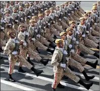  ?? AP/Iranian President’s Office ?? Iranian troops march Sunday during a military parade held outside Tehran to mark the 39th anniversar­y of the start of the Iran-Iraq war.