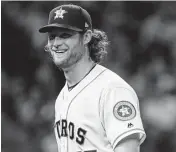  ?? Astros starter Gerrit Cole departs with a smile after striking out Nolan Arenado to end a solid six-inning stint with 12 strikeouts. Karen Warren / Staff photograph­er ??