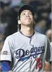  ?? Wally Skalij Los Angeles Times ?? DODGERS STARTER Kenta Maeda reacts after giving up a leadoff triple to Jason Heyward in the second inning.