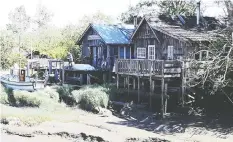  ??  ?? Finn Slough, at the south end of No. 4 Road in Richmond, features old homes in a marsh setting.