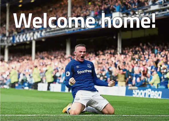  ?? — AFP ?? He’s back: Everton’s Wayne Rooney jubilating after scoring the winner against Stoke at Goodison Park on Saturday.