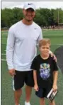  ?? MARK PODOLSKI — THE NEWS-HERALD ?? Mitchell Trubisky and Sam Podolski on June 11 at Jerome T. Osborne Stadium for Trubisky’s Mentor youth football camp.