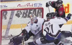  ?? BRU CE EDWARDS/EDMON TONJOURNAL /FILEs ?? Edmonton Ice goalie Bryce Wandler and defenceman Graham Belak in WHL action at the Northlands AgriCom in 1997.