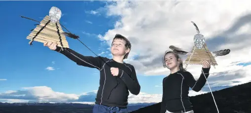  ?? PHOTO: GREGOR RICHARDSON ?? Learning to fly . . . George (9, left) and Meisha Romeril (8) try out their kites at a Manu Tukutuku workshop, held as part of the Puaka Matariki Festival, at Orokonui Ecosanctua­ry on Saturday.