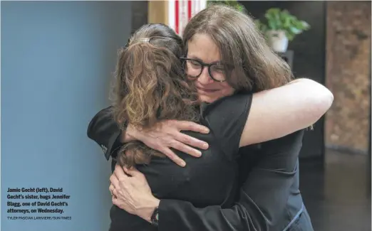  ?? TYLER PASCIAK LARIVIERE/SUN-TIMES ?? Jamie Gecht (left), David Gecht’s sister, hugs Jennifer Blagg, one of David Gecht’s attorneys, on Wednesday.