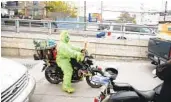  ?? ?? After the holiday-themed event to help the homeless and asylum seekers, Carlos Guillen takes off on his motorcycle dressed in a Grinch costume.