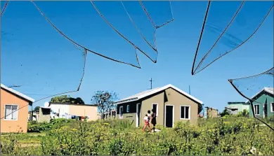  ?? Picture: ALAN EASON ?? SHATTERED PROMISES: A view through a broken window of a vandalised and unoccupied house in Unit P on the outskirts of Mdantsane. There are 154 houses in the area that have been unoccupied since 2013 because the rightful owners could not be located