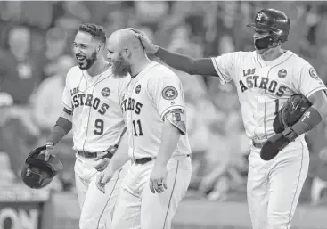  ?? Karen Warren photos / Houston Chronicle ?? A home run by Astros catcher Evan Gattis, center, drives in Marwin Gonzalez, left, and Carlos Correa to cap four-run fifth inning en route to a 6-2 victory over the Los Angeles Angels on Saturday at Minute Maid Park.