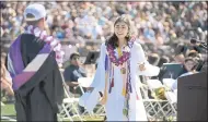  ?? ERIK CASTRO — THE PRESS DEMOCRAT VIA AP ?? Lulabel Seitz, right, argues with Petaluma High School Principal David Stirrat after her microphone was shut off by school officials during her valedictor­ian speech at the school’s graduation ceremony.