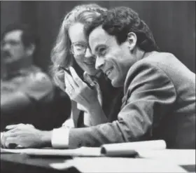  ?? POOL — THE ASSOCIATED PRESS FILE ?? Ted Bundy, right, confers with Margaret Good, a member of his defense team, during jury selection for Bundy’s murder trial in Miami, Fla. Bundy is accused of murdering two Florida State University students.