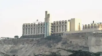  ?? — AFP photo ?? This picture shows a general view of the five-star Pearl Continenta­l hotel located on a hill in the southweste­rn Pakistani city of Gwadar, where gunmen stormed the building.