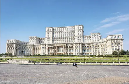  ?? CAMERON HEWITT ?? Bucharest’s massive Palace of the Parliament — the largest building in Europe — is an opulent monument to the megalomani­a of Nicolae Ceausescu.