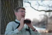  ?? ERIC BONZAR — THE MORNING JOURNAL ?? Colborn was on the lookout for a Western Grebe on May 1 1, at Lorain’s Century Park.