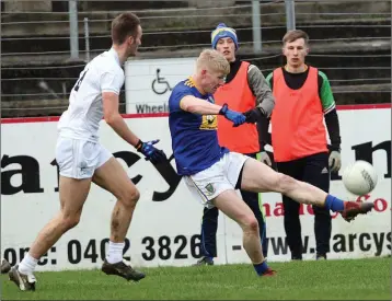  ??  ?? Mark Kenny of Wicklow is tracked by Liam Healy of Kildare.