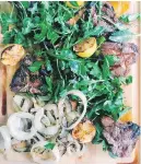  ??  ?? Grilled lamb chops and onions with herb salad can be made with loin or rib lamb chops.