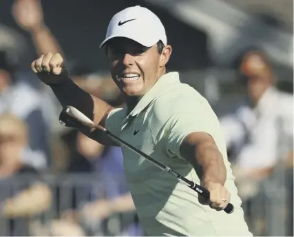  ??  ?? 0 Rory Mcilroy punches the air after holing a birdie putt on the 15th during his triumphant final round at Bay Hill.