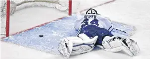  ?? AP PHOTO ?? Toronto Maple Leafs goalie James Reimer lays on the ice after getting beat on the game winning goal by Boston Bruins centre Patrice Bergeron during overtime in Game 7 of their NHL hockey Stanley Cup playoff series in Boston, Monday, May 13, 2013.