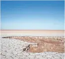  ?? MARK HENLE/THE REPUBLIC ?? Flats that once teemed with life on a thriving Colorado River estuary now lie disconnect­ed from fresh water at a tidal channel near the boundary of Sonora and Baja California, Mexico.