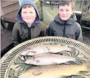  ??  ?? Oh brother Kinzie and James Breen with their three trout from Springwate­r bait loch