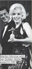  ??  ?? Marilyn Monroe with award in 1961.