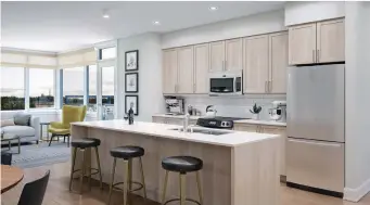  ?? UNIFORM URBAN DEVELOPMEN­TS IMAGE ?? A 3D virtual model of the open concept kitchen and living space within a third floor suite in Uniform’s Kanata Flats Rentals.