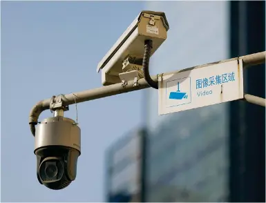  ?? Photos: Reuters ?? A Hikvision camera in operation in Beijing. The firm says it has complied with the laws of the countries where it operates in.