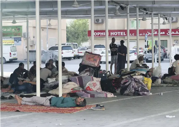  ?? The National ?? Evicted tenants of a residentia­l building on the street near the Sharjah Clock Tower where they have taken temporary shelter