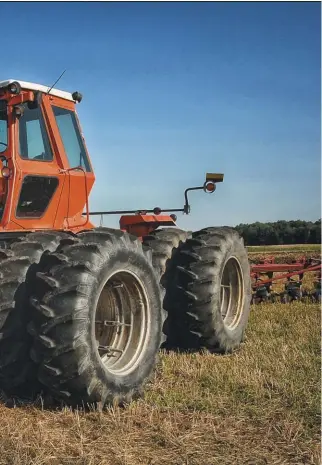  ??  ?? Mike Casey’s ‘78 8550 is seen here at the 2020 Alvordton Plowing Days in the summer of 2020. The Persian Orange make it jump out and if it’s size doesn’t help you spot it in the field, the color will. It’s the 330th 8550 built and is showing about 5,200 hours. It mounts the optional 3-point Cat 4 hitch and Stadium Lighting system. The dual stacks are a distinctiv­e feature of the 8550 as well. Mike bought the tractor about 4 years ago and while it still gets to work occasional­ly, it’s mostly a collector tractor these days. If you saw it at Alvordton, you’d know it was still loaded for bear and still a viable “big-league” tractor.