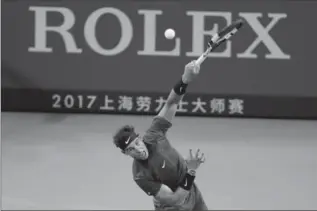  ?? ANDY WONG, THE ASSOCIATED PRESS ?? Rafael Nadal of Spain serves against Fabio Fognini of Italy during their men’s singles match in the Shanghai Masters tennis tournament Thursday. Nadan won the match, 6-3, 6-1.