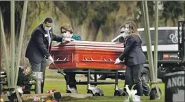  ?? Carolyn Cole Los Angeles Times ?? WANDA DESELLE, 76, died of COVID-19 on April 3 in Madera. Staff of the Jay Chapel funeral home handled the burial; family had to remain in their cars.